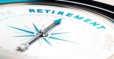 Compass with needle pointing the word retirement, concept image to illustrate retirement planning